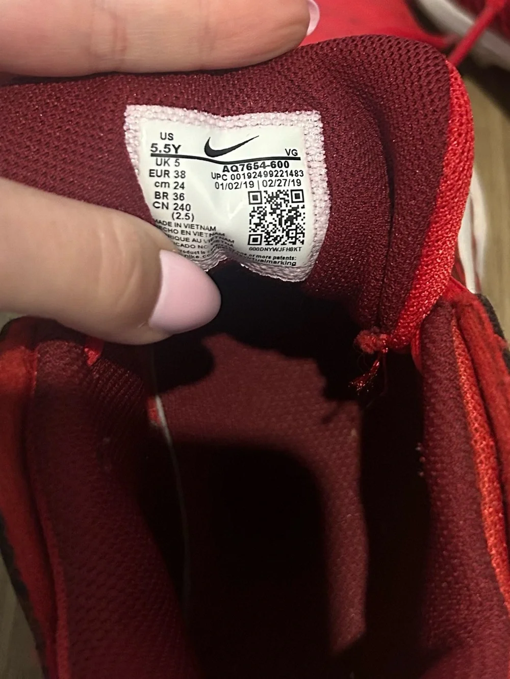 Kids' Red Cleats with White Swoosh